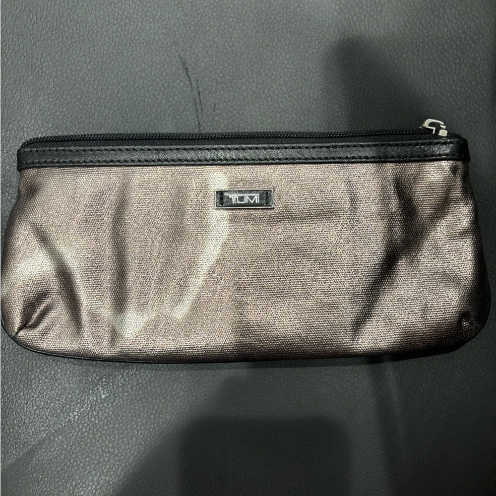 Well loved tumi clutch